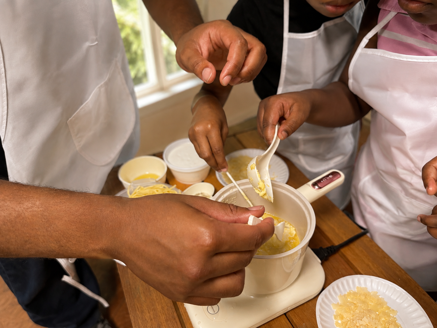 AOI students learning culinary arts in the kitchen